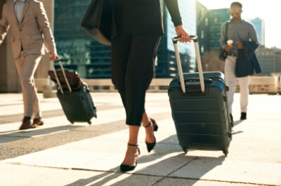 business people with luggage at an airport